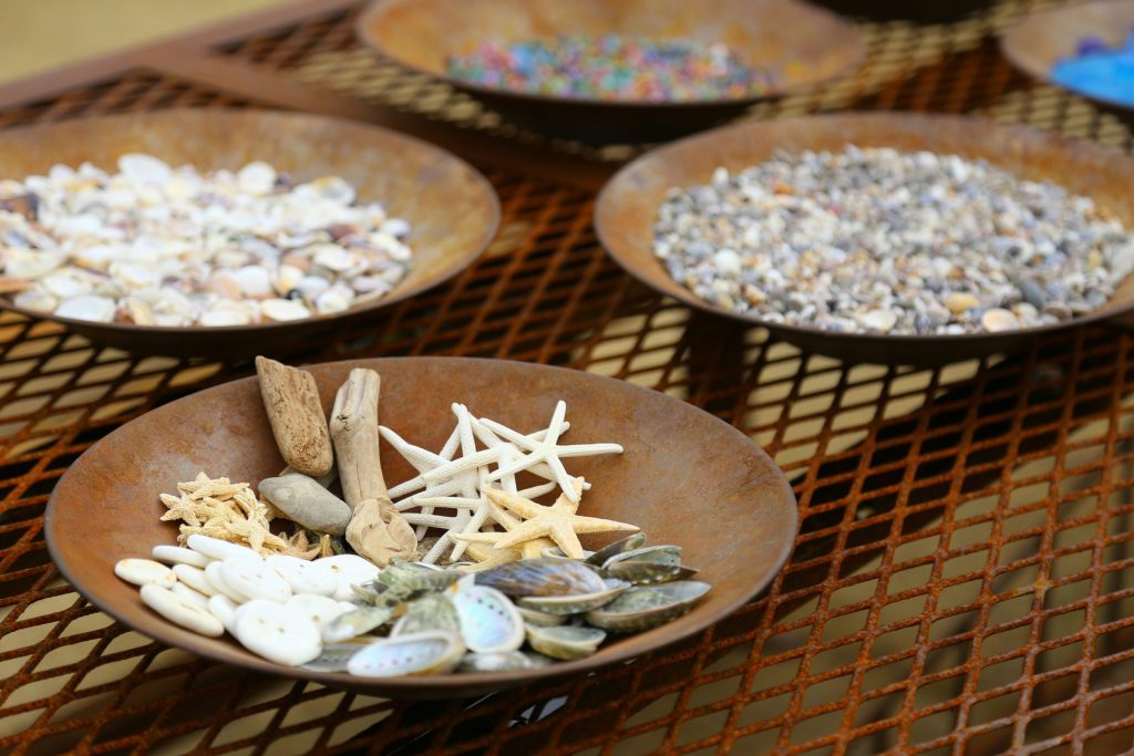 white and brown ceramic bowls on brown wooden table